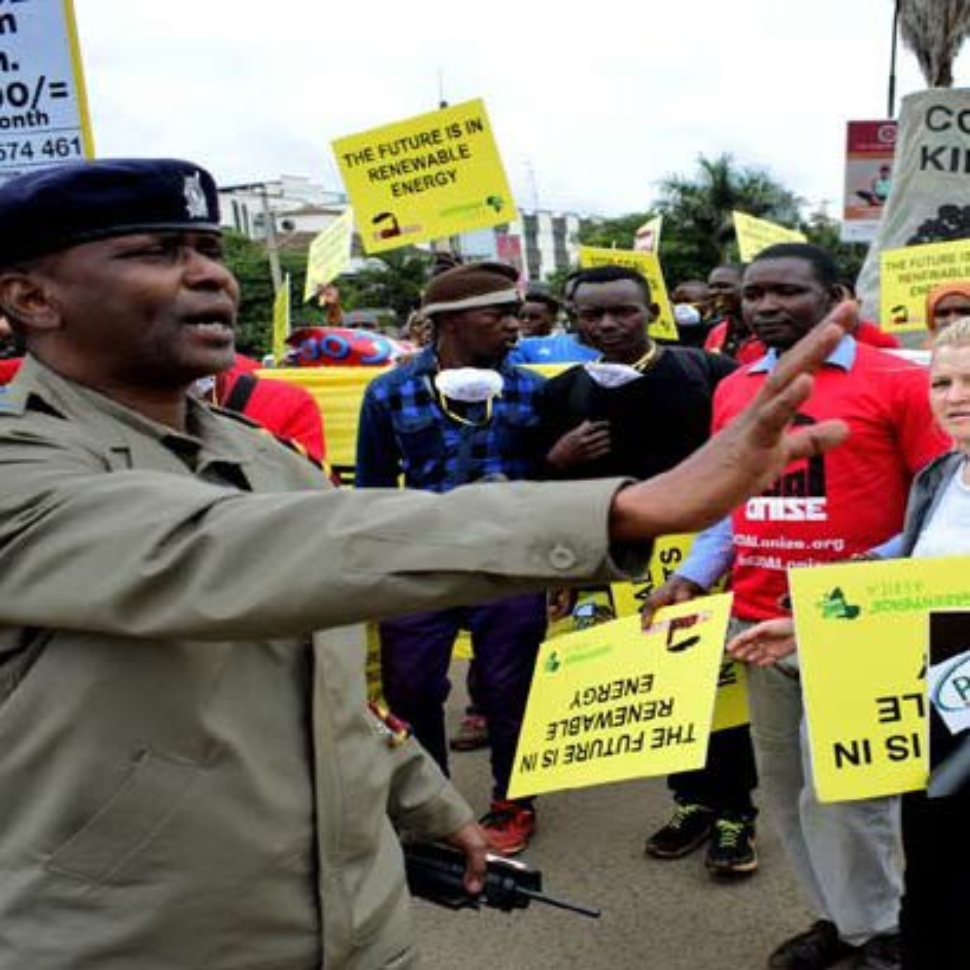 A-delegation-is-blocked-by-police-officers-during-a-demo-against-plans-to-build-East-Africa’s-first-coal-fired-power-plant-410x410