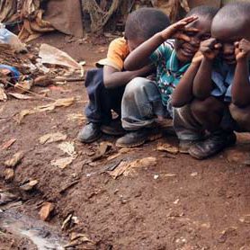 Children-in-an-informal-settlement-play-near-a-filthy-water-way-278x278