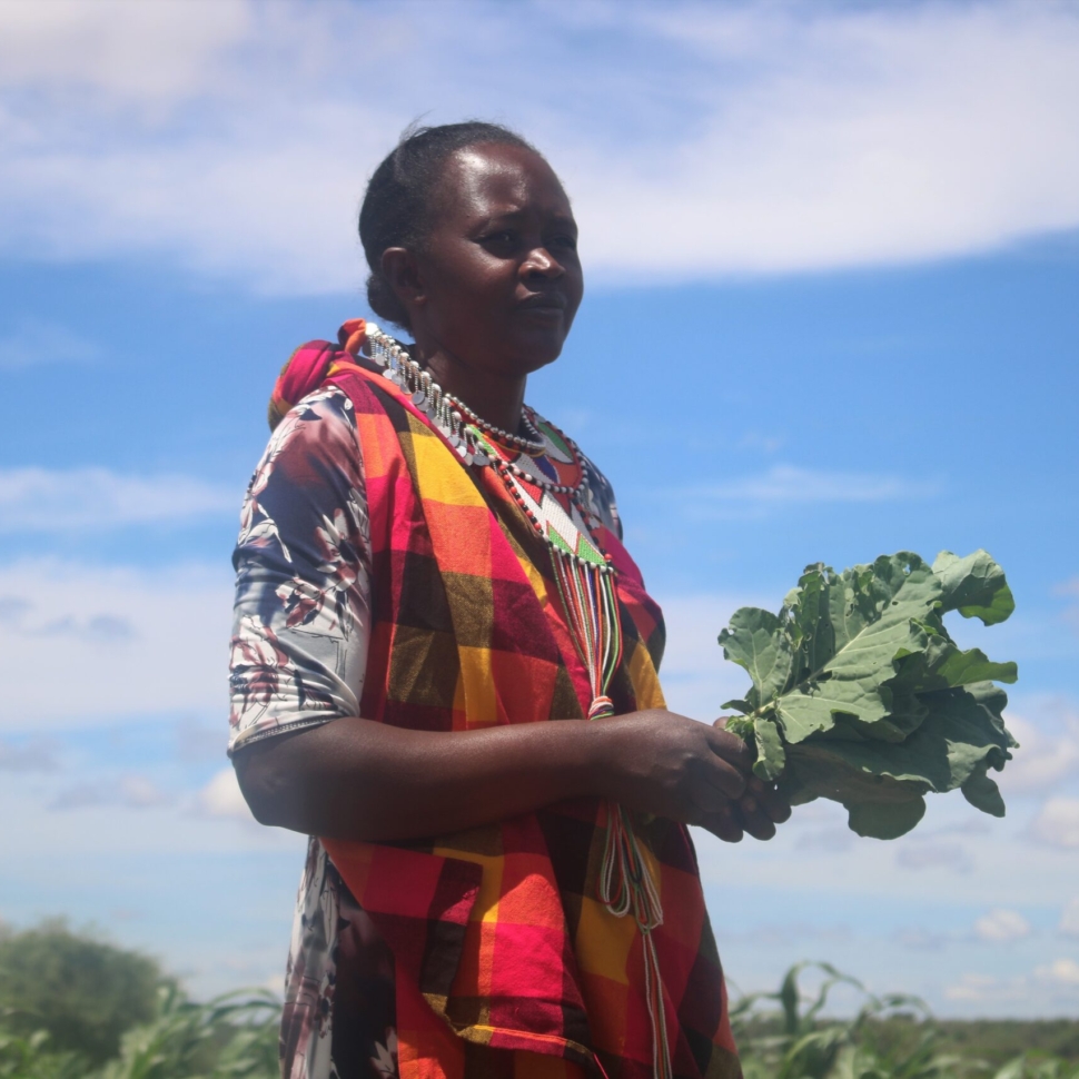 Hellen Nasha Lelegwe pose in her farm Lching'ei village.She has turned to kitchen garden to dodge climate change
